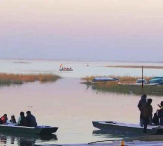 Boats on a lake at dusk